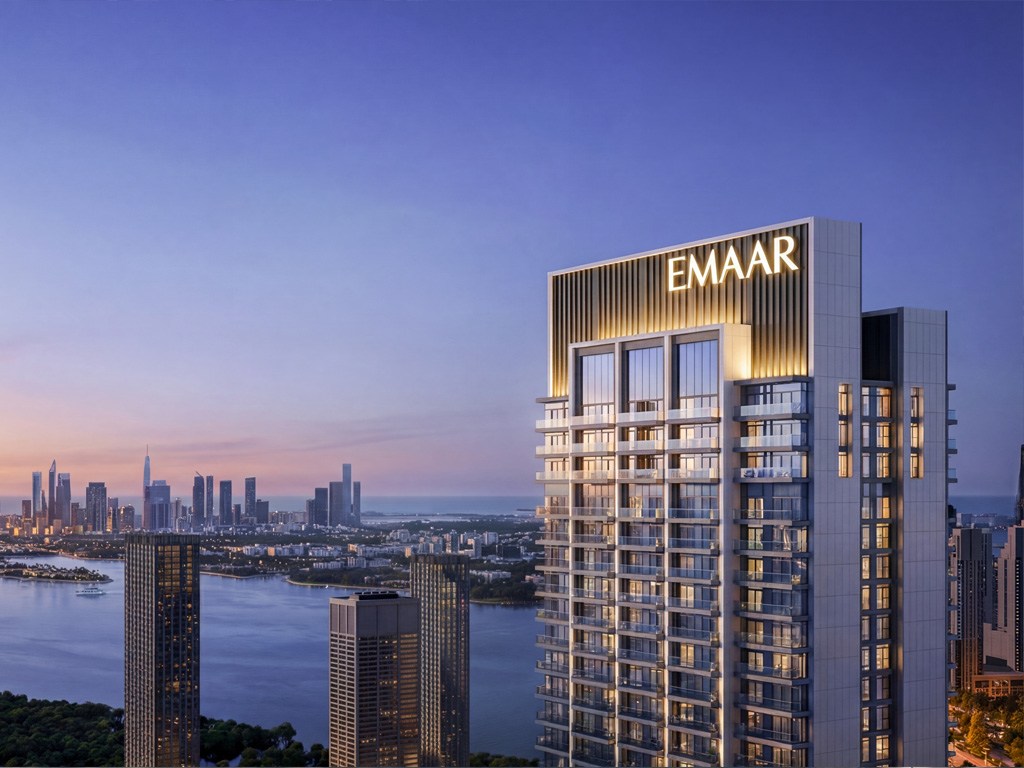 Upper crown of the Valia tower with Emaar branding at twilight